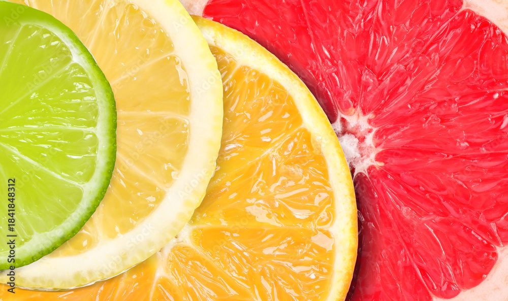 Fototapeta premium Citrus fruits as background. Slices of orange, lime, lemon and grapefruit, top view