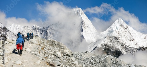 Group of hikers or tourists on glacial moraine