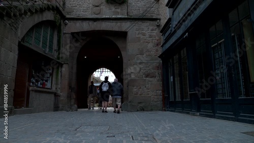 Mont-Saint-Michel, Normandy, 08-24-2024. Medieval shops inside the walls of Mont Saint Michel. Slow motion 4K
