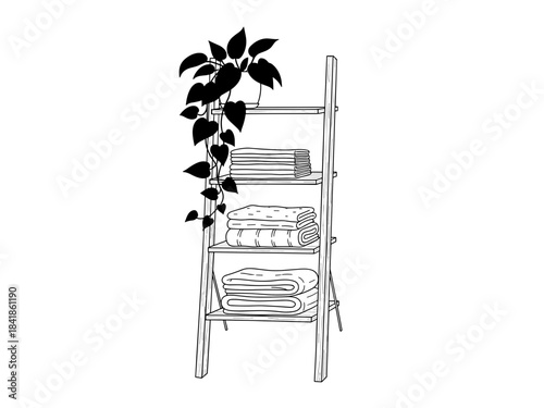 Wooden shelf with neatly arranged towels and decorative plant  