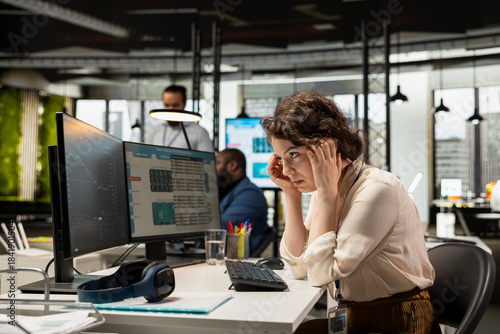 Tableau sur toile Stressed sad female consultant looks at stock crash trends market fall and worrying about a financial crisis
