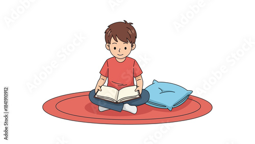 A young boy sits cross-legged on a red rug, engrossed in reading a book, with a blue pillow beside him.