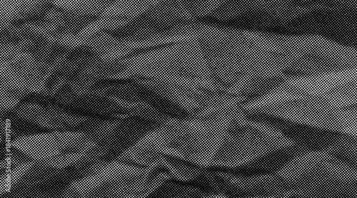 Halftone crumpled paper texture with wite a dotted, rough, and wrinkled surface. Black creased sheet background in comic pop-art style, featuring grainy folds and gritty distressed details.