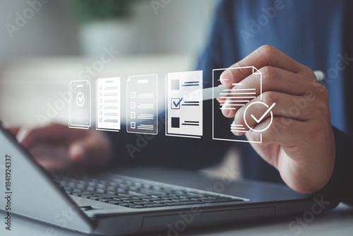 Businessman using laptop for digital document management paperless approval, technology workflow automation business process efficiency project authorization and corporate management approval concept.