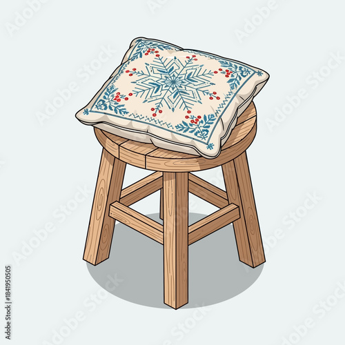 Decorative embroidered winter snowflake cushion placed on a rustic wooden stool for cozy home decor