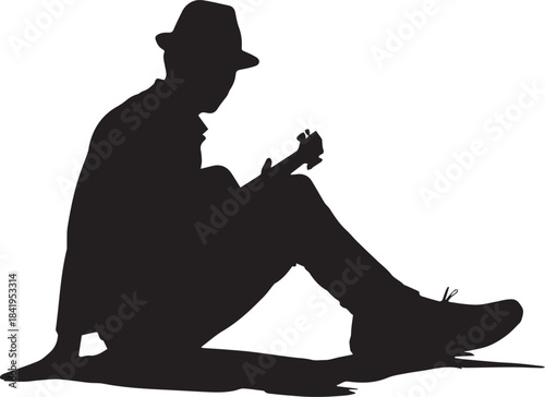 Silhouette of a man wearing a fedora hat playing a small guitar