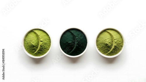 Vibrant green and blue spirulina powder in bowls for wellness and nutrition, ideal for showcasing healthy lifestyle products and vibrant food concepts