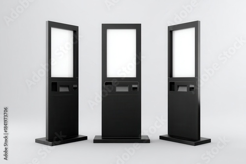 Vibrant photo of Three black self-service kiosks with blank screens, isolated on white background.