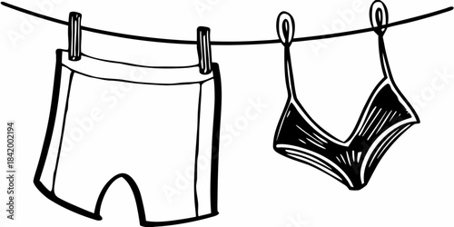 A simple black and white illustration of swimwear hanging on a clothesline