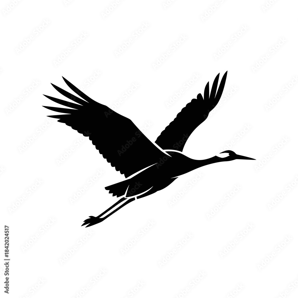 Fototapeta premium Black silhouette of a crane bird in graceful flight with wings spread wide against a plain background.