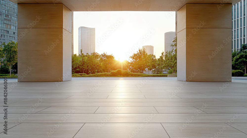 Naklejka premium Modern open building entrance with smooth tile floor and warm sunset light
