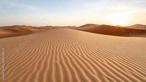Sand dune desert sunrise rippled sand desert landscape serene warm glow