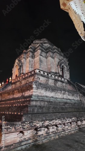 Lanterns at Wat Chedi Luang Buddhist temple at night in Chiang Mai, Thailand