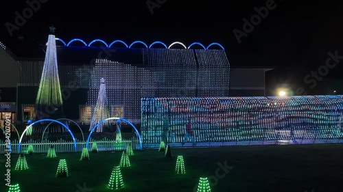 Christmas holiday outdoor lights, festive light show at night