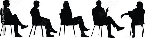 Diverse group of anonymous people sitting on chairs in a row, waiting, listening, and engaging in conversation or a serious team discussion.