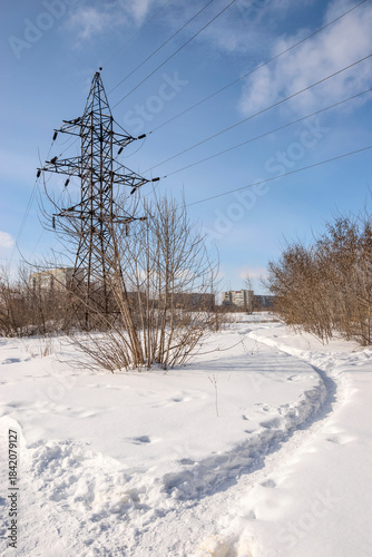 Paths through snowdrifts on the outskirts of the city