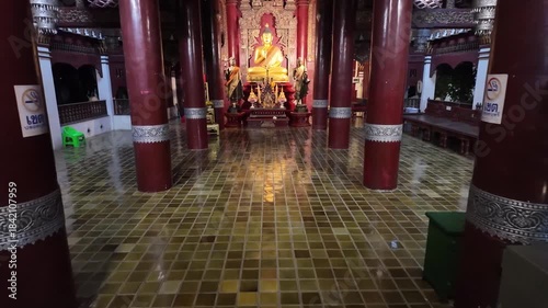 Walking in to Wat Pan Sao Buddhist temple at night in Chiang Mai, Thailand