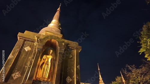 Walking around Wat Phra Singh Woramahawihan Buddhist temple at night in Chiang Mai, Thailand