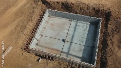 Construction of a concrete foundation for a building.