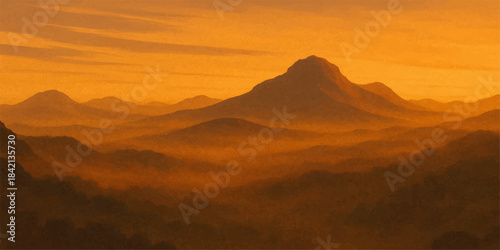 Mountain landscape with vibrant orange and yellow sunrise and sunset light painting the sky, clouds, and silhouettes of hills