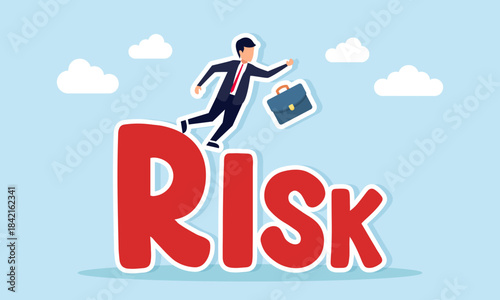 Businessman slipping and falling from the word RISK illustrating miscalculated business risk management