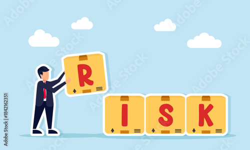 Businessman arranging RISK boxes illustrating effective and organized business risk management
