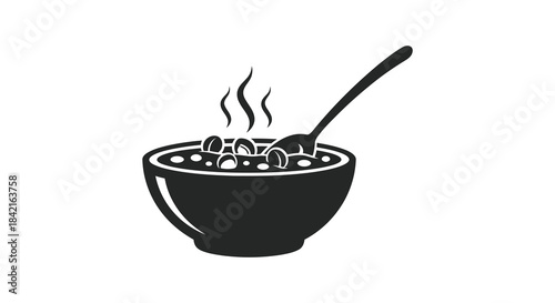 A steaming bowl of soup with a spoon presented in a stark black silhouette