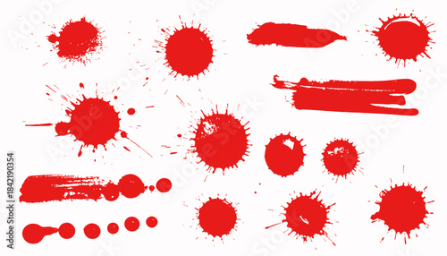 Assortment of red paint splatters, splashes, and brushstrokes on a white background
