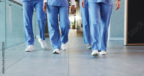 Bild auf Leinwand Legs, people and nurses walking in hospital for staff duty, shift change and medical services