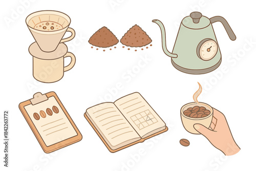 Hand holding a cup of coffee next to a book and a coffee grinder