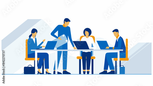 Business team collaborating around a table with laptops