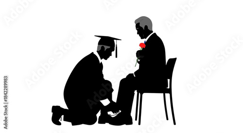 Graduate Shows Gratitude by Tying Fathers Shoe.