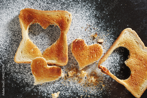 Toasted bread with cut out heart-shaped slice