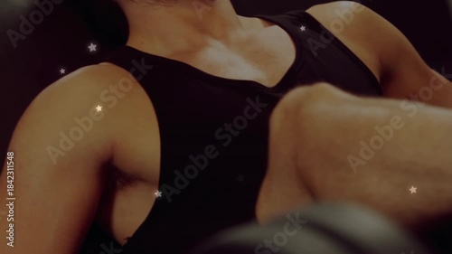 Man pressing pad, leg pressing in gym for strength, star overlay tracking, camera widening to face