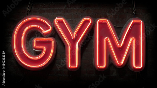 Bright neon gym sign against a dark background at night