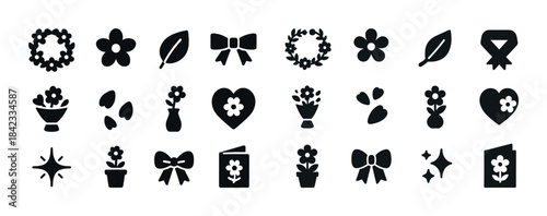 Floral icon set: flowers, leaves, bows, and hearts in black silh
