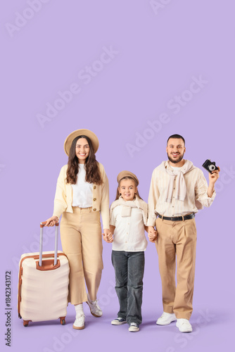 Family of travelers with su...