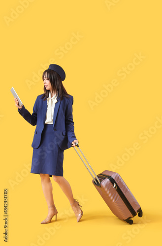 Asian stewardess with table...