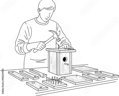 Man building birdhouse with hammer and wood pieces