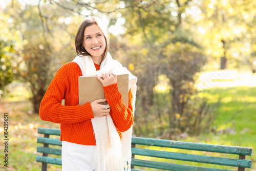 Happy young woman in scarf ...