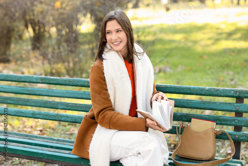 Happy young woman with hand...