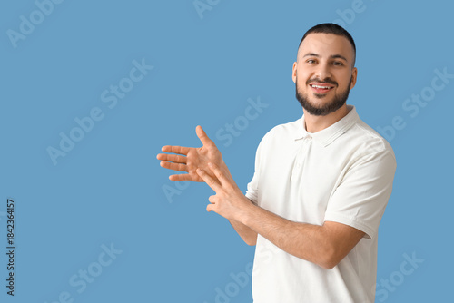 Young man using sign langua...