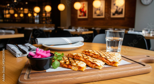 Korean-Mex fusion restaurant scene featuring a kimchi quesadilla with charred edges, side of pickled radish, modern minimal table setup