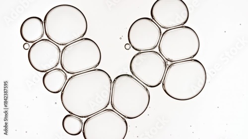 Bubble cluster transparent, cells under a microscope on white background. Gel texture with bubbles, skin care product. Macro Shot of Natural Organic Cosmetics, Medicine. High quality 4k footage