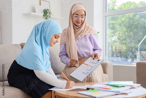 Muslim mother with her litt...