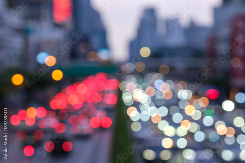Blurred aerial view from overpass with traffic jam on main road in capital on evening, which is the time rush hour when people get off work