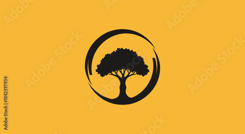 A black silhouette of a tree enclosed in a rough circle on a golden background