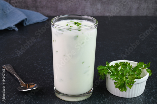Tableau sur toile Serving buttermilk drink in a glass cup.