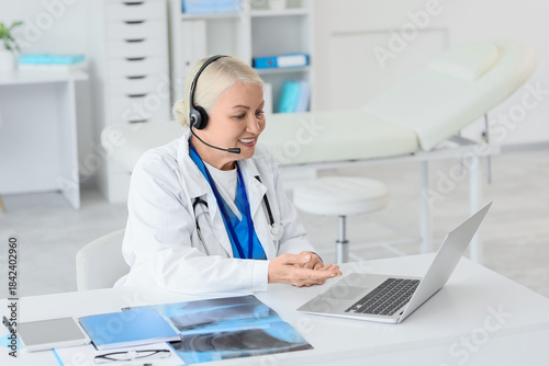 Female doctor in headset wi...