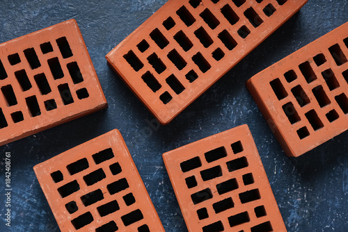 Orange bricks on blue grung...